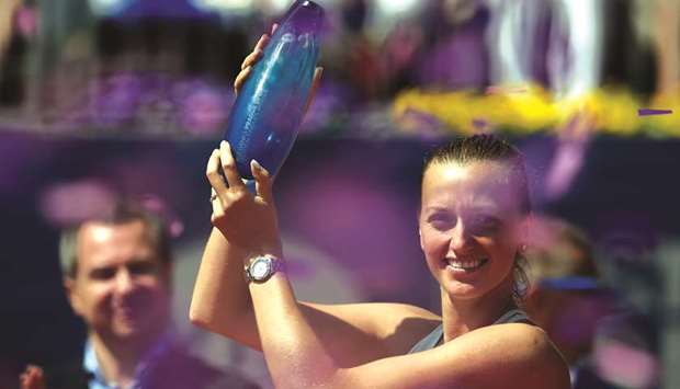 Petra Kvitova of the Czech Republic celebrates with the trophy after defeating Romaniau2019s Mihaela Buzarnescu in their final of the Prague Open yesterday. (AFP)