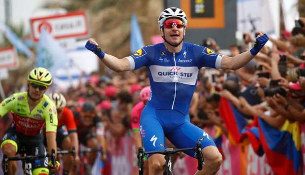 Team Quick-Stepu2019s Italian rider Elia Viviani celebrates as he crosses the finish line to win the second stage of the 101st Giro du2019Italia in Tel Aviv yesterday. (AFP)