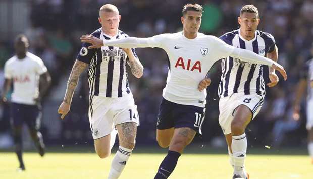 West Bromu2019s James McClean (left) and teammate Jake Livermore (right) vie for the ball with Tottenhamu2019s Erik Lamela during their English Premier League match at The Hawthorns in West Bromwich yesterday. (Reuters)
