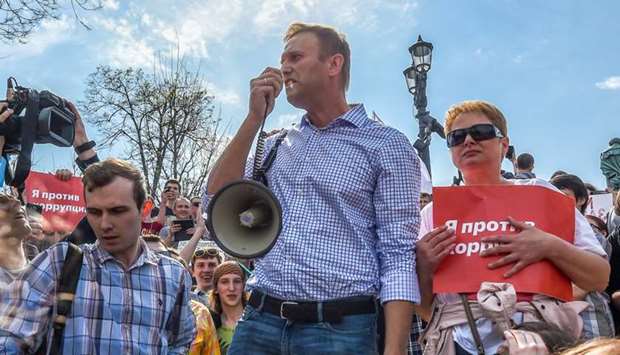 Russian opposition leader Alexei Navalny (C) attends a protest rally ahead of President Vladimir Putin's inauguration ceremony yesterday in Moscow.