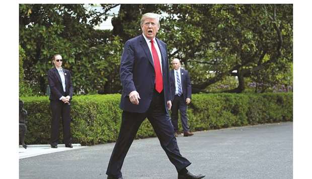 US President Donald Trump walks to Marine One as he departs for Cleveland, Ohio, from the South Lawn of the White House in Washington yesterday. Trump seems set on pulling out of the Iran nuclear deal next week, with US officials suggesting that any initial diplomatic turbulence will be followed by negotiations for a new accord.