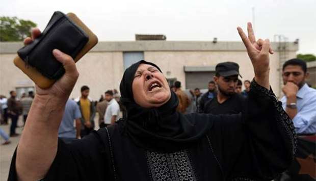 A relative of a Palestinian who was killed at the Israel-Gaza border reacts at a hospital in Gaza Strip on Sunday.