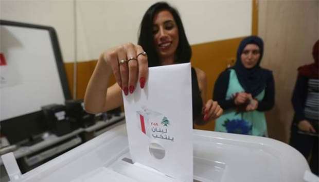A woman casts her vote in Lebanon's first legislative election in nine years at a polling station in the Christian town of Zahle, in the eastern Bekaa valley, on Sunday.