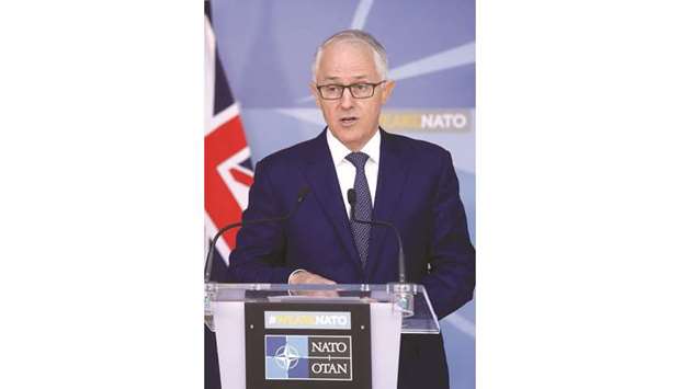 Australian Prime Minister Malcolm Turnbull speaks at a news conference after a meeting with Nato Secretary-General Jens Stoltenberg at the Allianceu2019s headquarters in Brussels. Turnbull wants to cut company tax rates to 25% from 30% over a decade in a bid to increase jobs and wages.