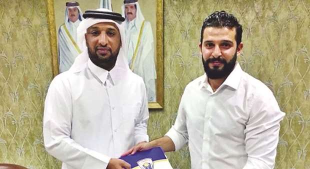 Al Kharaitiyatu2019s new coach Nassif al-Bayawi with the teamu2019s Head of Football Mansoor Moussa.