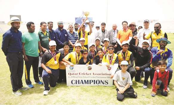 QCA president Yousef Jeham al-Kuwari, QCA Operations manager Manzoor Ahmad and other officials pose with the Stallions Academy team after they won the U-14 (Boys) Inter School Cricket Tournament 2018.