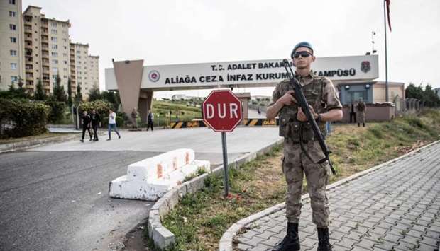 Turkish soldiers stand guard at the entrance of the Aliaga court and prison complex, during the trial of US pastor Andrew Brunson, held on charges of aiding terror groups, in Aliaga, north of Izmir. AFP