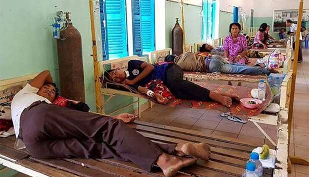Cambodian patients are confined at a hospital in Kratie province after drinking contamintated liquid.