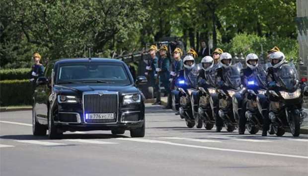 Motorcyclists escort President Vladimir Putin's Russian-made limousine, part of the Cortege project, during an inauguration ceremony at the Kremlin in Moscow on Monday.