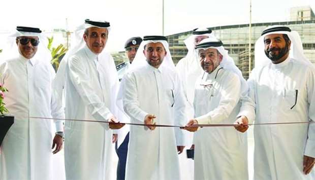 Dr Hassan al-Derham inaugurates the new parking facility in QU as other officials look on.