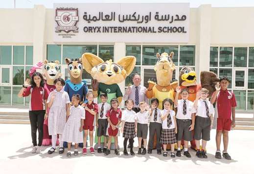 GROUP: The students and the mascots in a group photo.