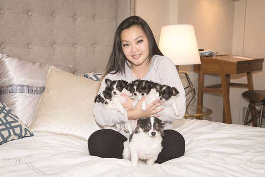 DELIGHTED: Meesha Kauffman on the day she picked up the cloned puppies of her long-haired chihuahua Bruce Wayne.