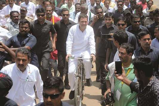 All India Congress Committee president Rahul Gandhi rides a bicycle during an election campaign for the forthcoming Karnataka legislative assembly elections in Malur, about 60km from Bengaluru yesterday.