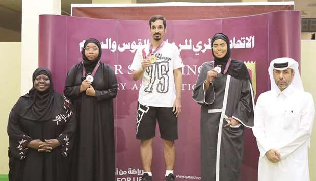 Ali Hassan (centre) poses with the gold medal in the mixed 10m pistol event with second-placed Dana al-Mubarak, third-placed Nusra Mohamed and officials in the Qatar Cup Shooting and Archery Championship at the Losail Ranges.