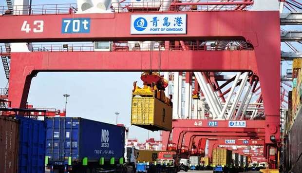 Containers are transferred at the port in Qingdao in China's eastern Shandong province