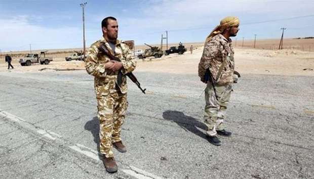 Libyan soldiers at a check point near Sirte