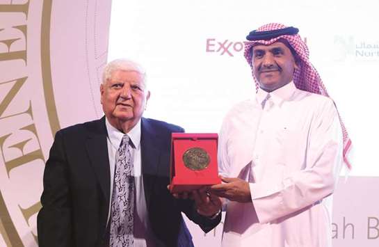 Qatargas CEO Sheikh Khalid bin Khalifa al-Thani receiving the award from HE Dr Ibrahim  Ibrahim, economic adviser at Amiri Diwan and vice-chairman, The Abdullah Bin  Hamad Al-Attiyah International Foundation for Energy & Sustainable development.