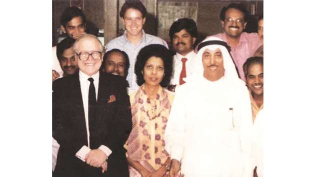 Brian Nicholls (left) and Yousuf Jassem al-Darwish (right) are seen with Shanti Rodrigues, Arvind Nair, Babu Mather and some other colleagues during a function in the Gulf Times editorial department in 1990.