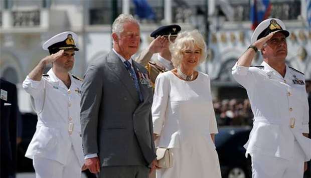 Prince Charles and Camilla attend a wreath laying ceremony at the Tomb of the Unknown Soldier in Athens on Wednesday.