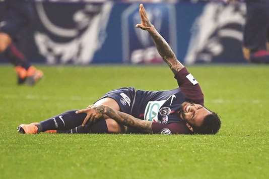 Paris Saint-Germainu2019s defender Daniel Alves he lies on the ground injured during the French Cup final against Les Herbiers on Tuesday night. (AFP)