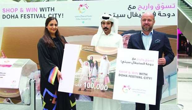 Doha Festival City officials announce the second winner of the Shop & Win campaign.