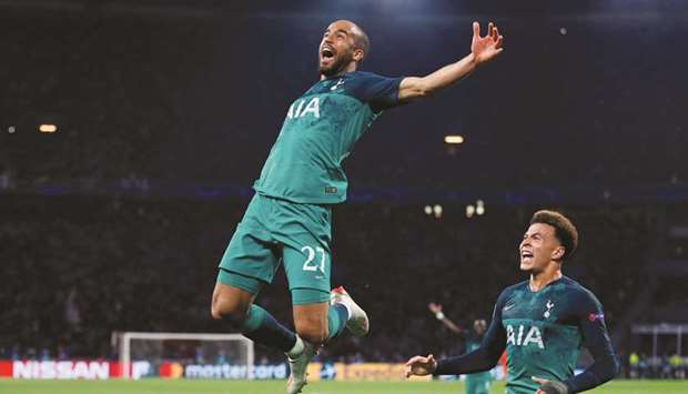 Tottenhamu2019s Lucas Moura celebrates scoring their third goal to complete his hat-trick with Dele Alli (R) on Wednesday.