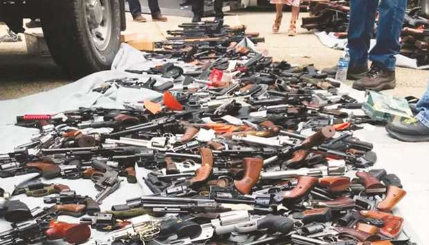 This image obtained from the Los Angeles Police Department (LAPD) shows weapons seized from a home in Los Angeles, by the Bureau of Alcohol, Tobacco and Firearms (ATF) and the LAPD.