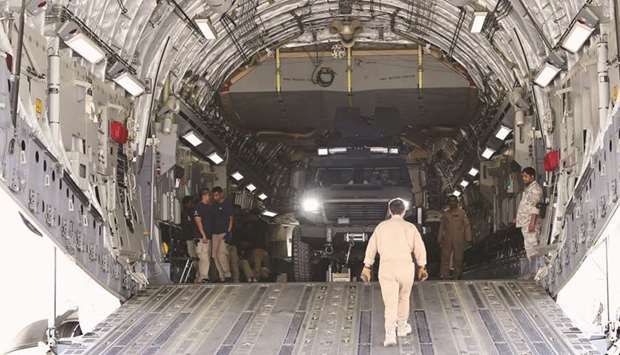 The armoured vehicles being unloaded in Ouagadougou.