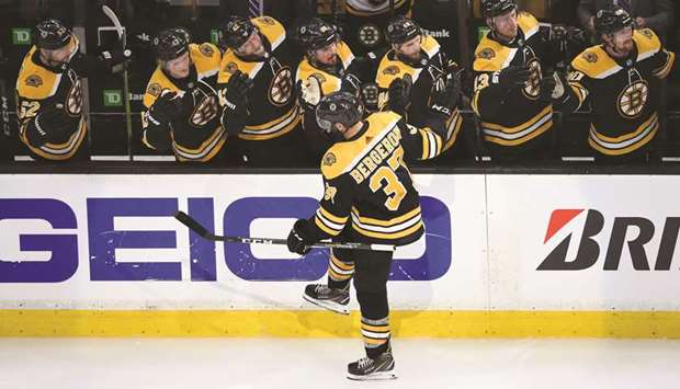 Patrice Bergeron of the Boston Bruins celebrates with teammates after scoring a goal during the third period against the Carolina Hurricanes in game one of the Eastern Conference final of the 2019 NHL Stanley Cup playoffs at TD Garden in Boston. (Getty Images/AFP)