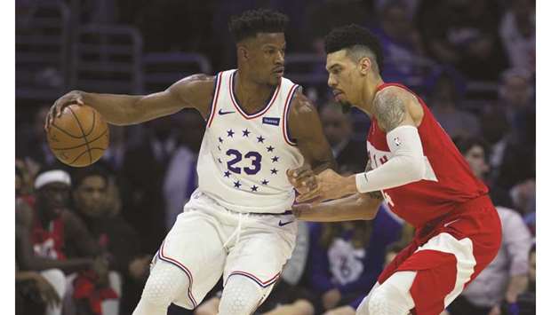 Jimmy Butler (left) of the Philadelphia 76ers dribbles the ball against Danny Green of the Toronto Raptors in the first quarter of game six in Philadelphia, Pennsylvania. (AFP)