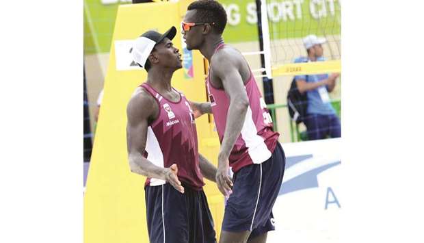 Qataru2019s Ahmed Tijan and Cherif Younousse celebrate after winning a point during thae 2019 Asian Senior Beach Volleyball Championships in Maoming, China, yesterday.