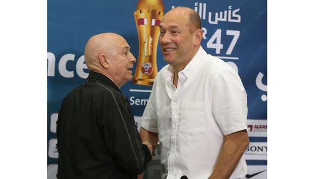 Al Sadd coach Jesualdo Ferreira (L) with his Al Rayyan counterpart Gilson de Souza at their pre-match press conference.