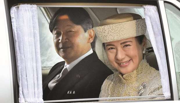 Japanu2019s Crown Prince Naruhito and Crown Princess Masako arrive at the Imperial Palace in Tokyo.