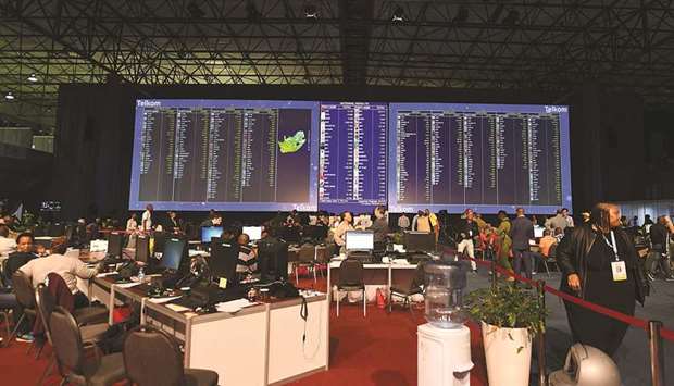 People look at election results boards, at the Independent Electoral Commission (IEC) Results Operations Centre in Pretoria, South Africa.