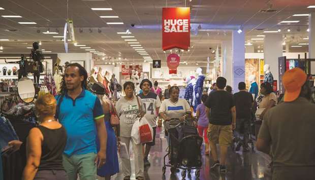 Customers shop at a store at the Gateway Shopping Center in the Brooklyn borough of New York (file). The Consumer Price Index increased 0.3% last month, lifted by rising gasoline, rents and healthcare costs, the Labour Department said yesterday.