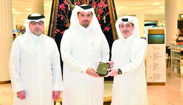 Sheikh Hamad Abdulla al-Thani with Adel Ali Bin Ali and Nabeel Ali Bin Ali at the unveiling of the Xiaomi Mi MIX 3 5G.