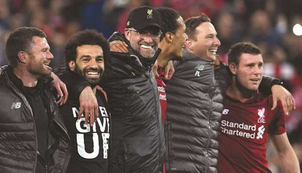 Liverpool manager Jurgen Klopp (third from left) and his men are upbeat after qualifying for the Champions League final.