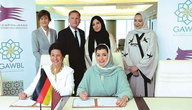 Aisha Alfardan and Kratochwil sign MoU as Muzel and other officials look on. PICTURE: Ram Chand