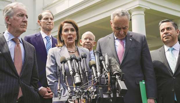 Senate Democratic Leader Chuck Schumer, House Speaker Nancy Pelosi and other congressional Democrats speak to reporters after their meeting on infrastructure with US President Donald Trump at the White House in Washington yesterday.
