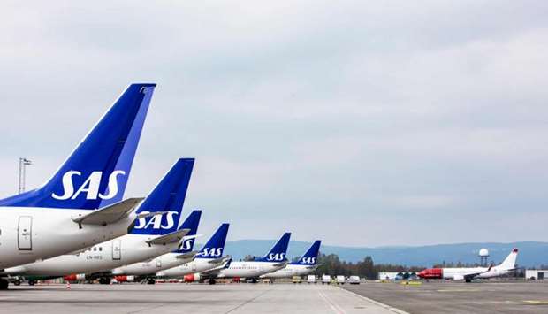 Airplanes of the Scandinavian Airlines' SAS company park on ground at the Gardamoen Airport during a strike of pilots to contest wages and working hours on April 26, 2019 in Oslo, Norway