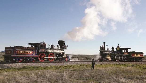 Replicas of the historic Jupiter and No 119 steam locomotives pass each other on the 150th anniversary of the completion of the Transcontinental Railroad at Golden Spike National Historical Park in Promontory, Utah, on Friday.