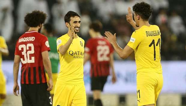Al Sadd players celebrate after scoring their first goal against Al Rayyan in the first semi-final of the Amir Cup at the Sheikh Jassim bn Hamad Stadium last night. PICTURE: Noushad Thekkayil