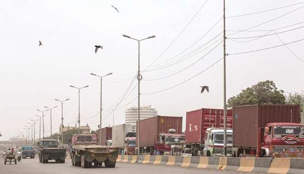 Trucks moving on the port road in Karachi. The contraction in Pakistanu2019s trade deficit is mainly attributable to a steep fall in the overall import bill, even though export proceeds posted a mixed trend during the period under review.