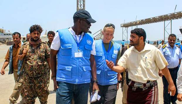 Members of the United Nations observer mission meet with local officials during the Yemeni Houthi rebel withdrawal from Saleef port in the western Red Sea Hodeidah province.