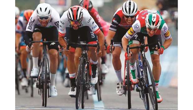 Colombiau2019s Fernando Gaviria (centre) competes the final sprint flanked by Italyu2019s Elia Viviani (right) during the stage three of the 102nd Giro du2019Italia. (AFP)