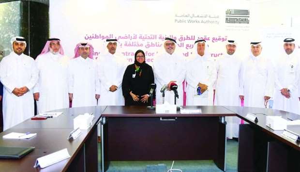 Ashghal president Saad bin Ahmad al-Muhannadi, other officials, CMC members and representatives of companies at the signing ceremony on Monday. PICTURE: Jayan Orma.