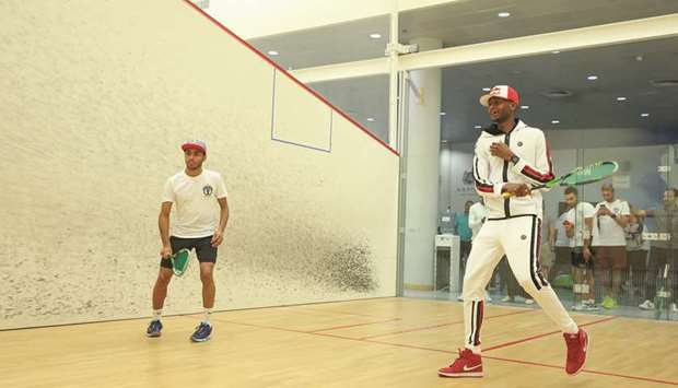 Abdulla al-Tamimi (left) played a friendly match of squash with High Jump world champion Mutaz Barshim during the launch of his academy.