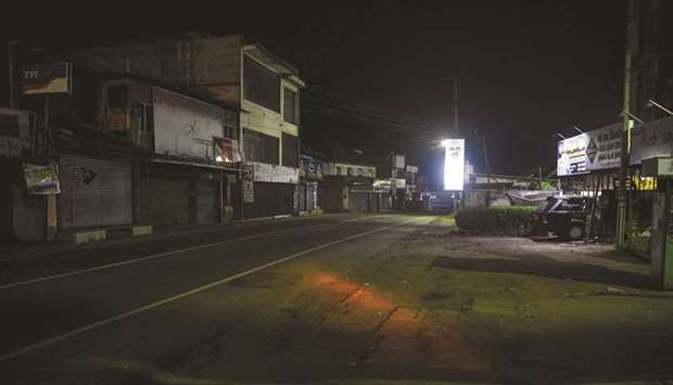 A general view of the empty streets after the police clamp curfew in Pugoda, about 35km from Colombo.