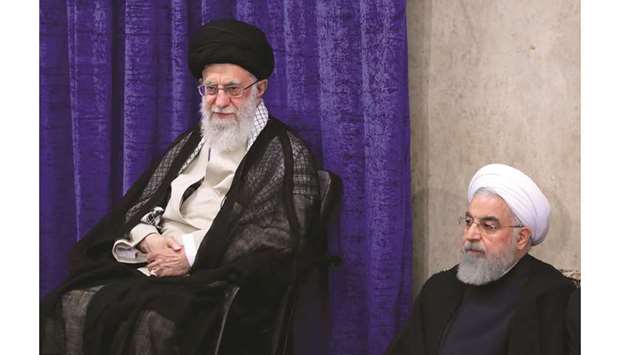 A handout picture shows Iranu2019s Supreme Leader Ayatollah Ali Khamenei and President Hassan Rouhani attending a government meeting in the capital Tehran.
