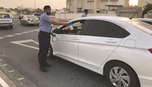 A motorist being offered an Iftar meal.